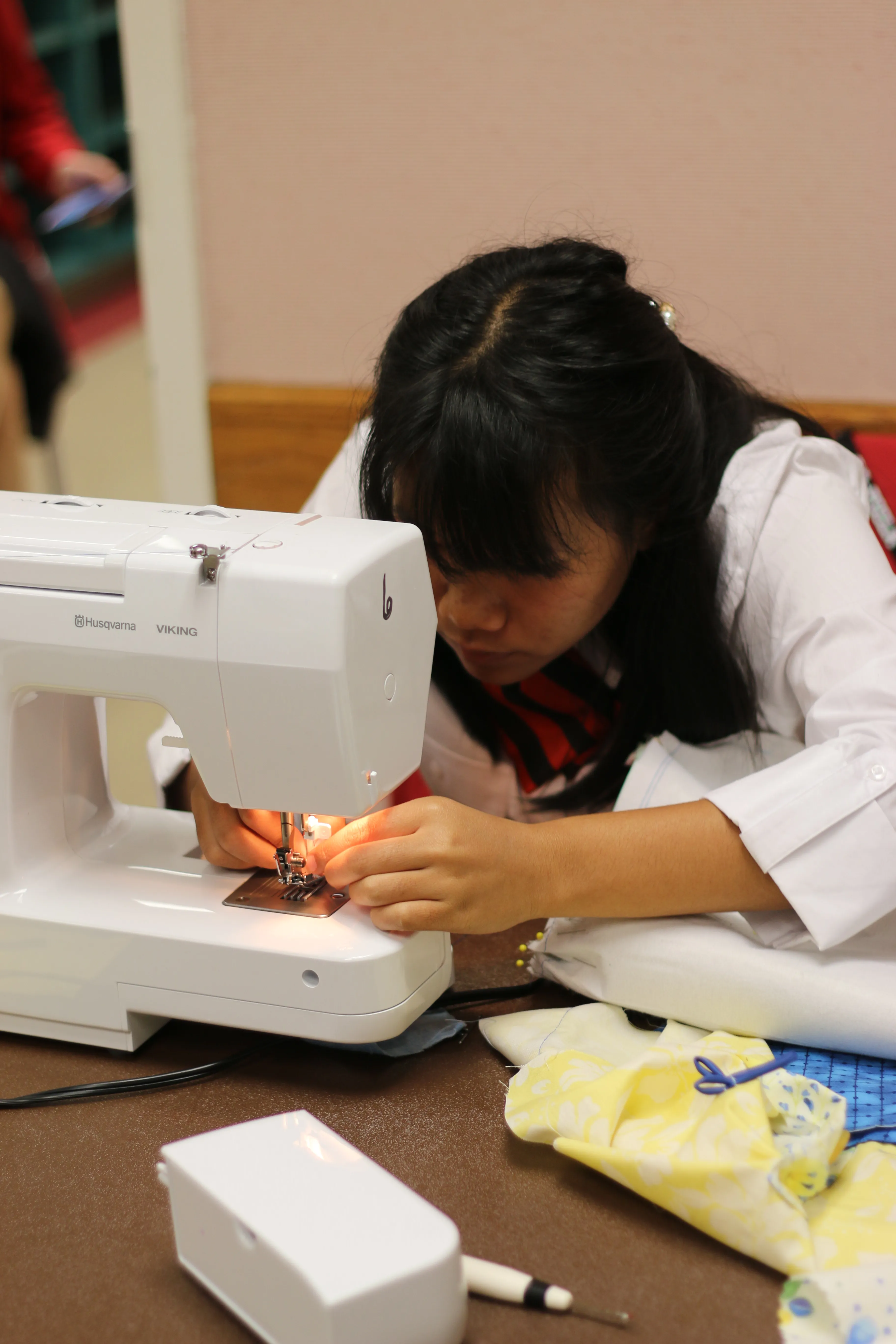 person working with a sewing machine